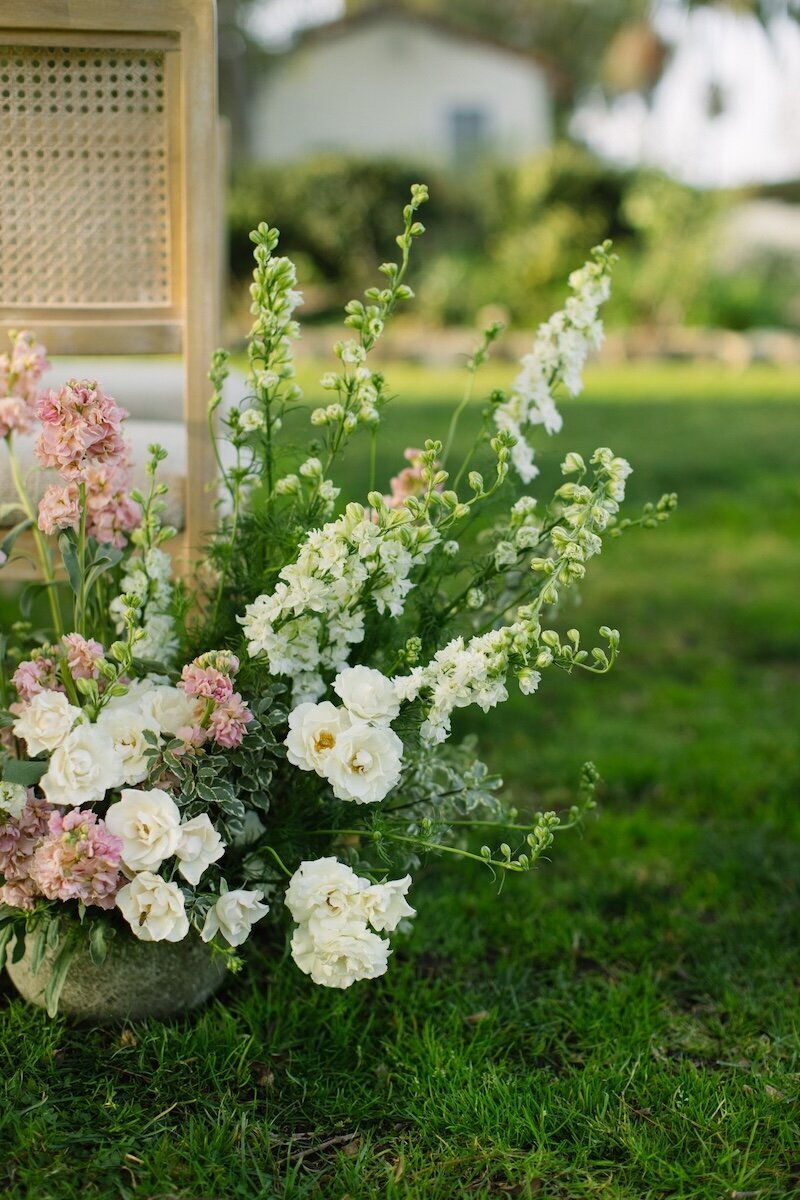 Ceremony aisle floral arrangements at a Mission Ranch Hotel wedding in Carmel, CA