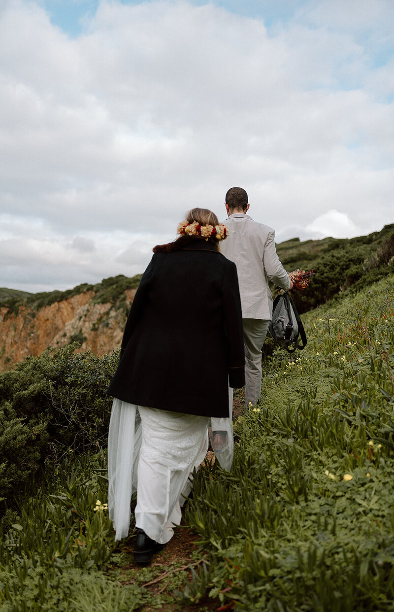 Bride and groom hiking during their adventure elopement in Europe