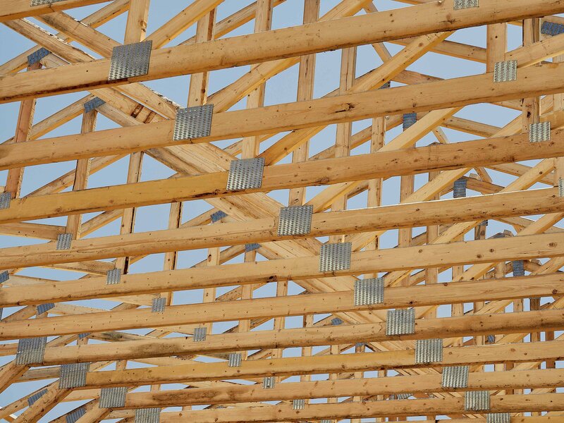 Wood roof trusses raised center