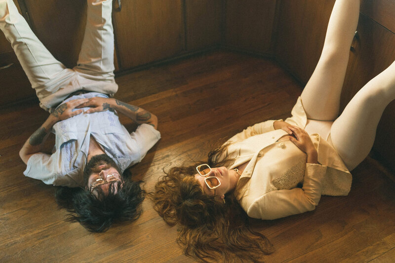 couple laying on the floor together