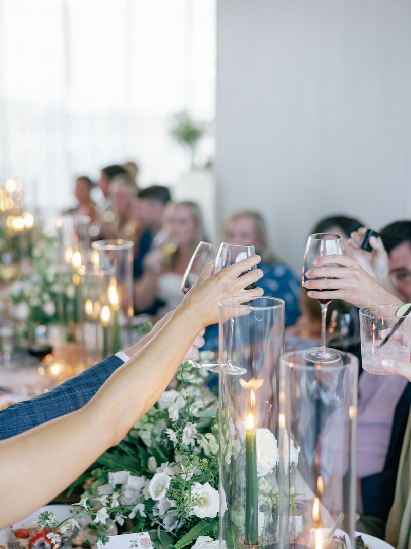 Wedding guests toast their bride and groom