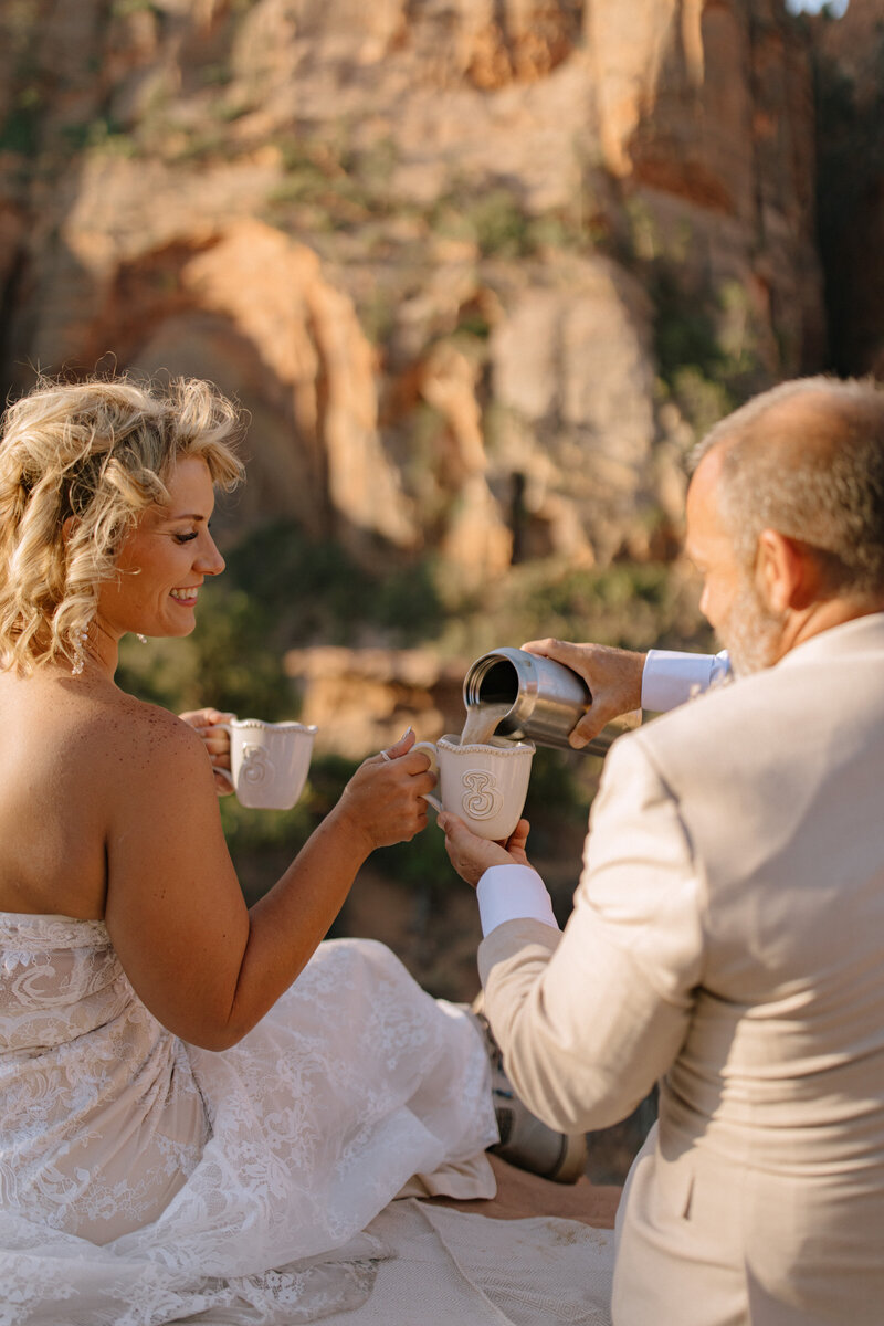 Couple exchanging vows at Zion National Park overlook captured by Utah elopement photographer