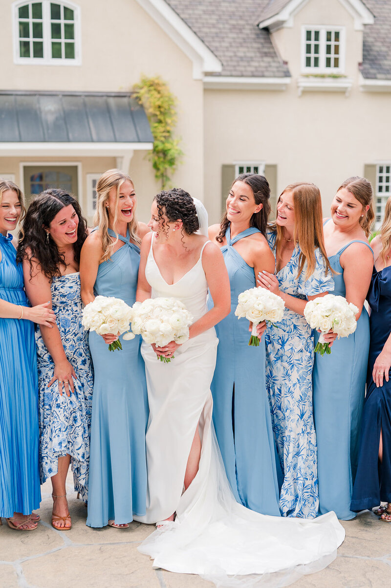 a bride standing with her bridesmaids
