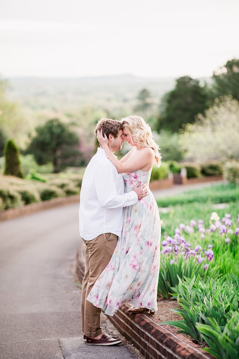 Couple with foreheads together in gardens by Knoxville Wedding Photographer Amanda May Photos