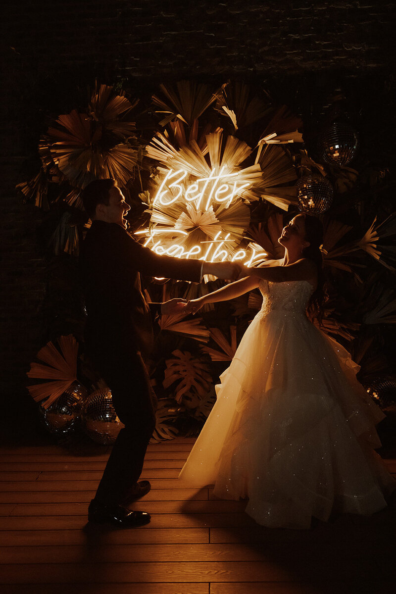 better together happy couple dancing at night