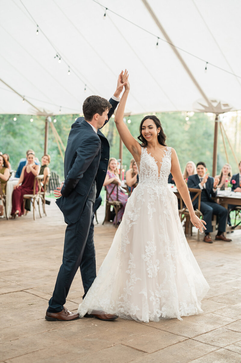 A man and woman dancing to their first dance song
