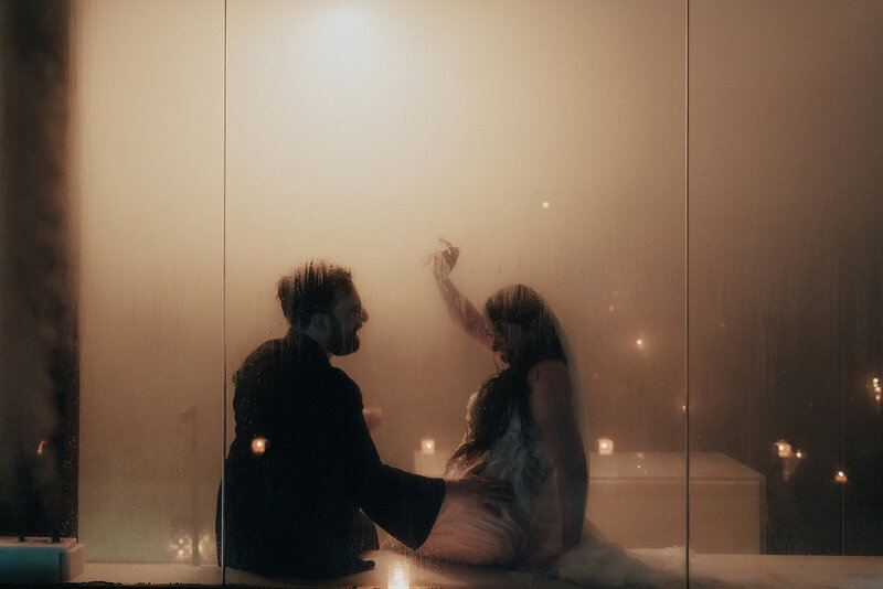Historic first-ever wedding at any AIRE Ancient Baths location, featuring bride and groom in steamy candlelit pool in Chicago, captured by Bradi Potter