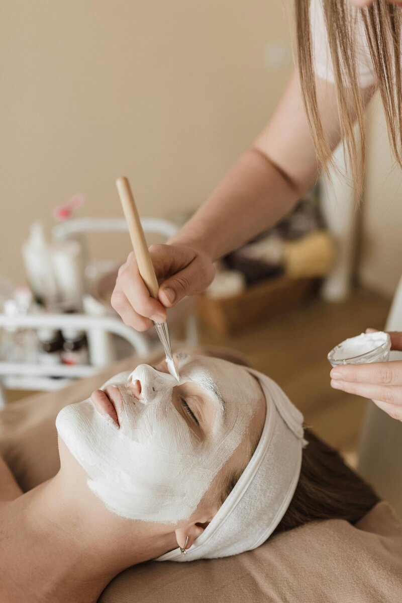 	Client during deep cleansing facial with French skincare products at Beauty Oasis MTL