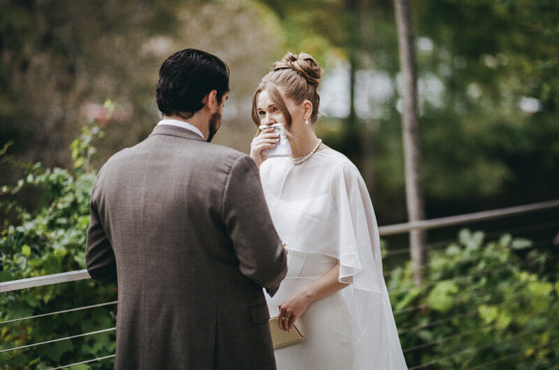 Bride and groom give private vows behind the Roundhouse in Beacon on 35mm film while bride tears up
