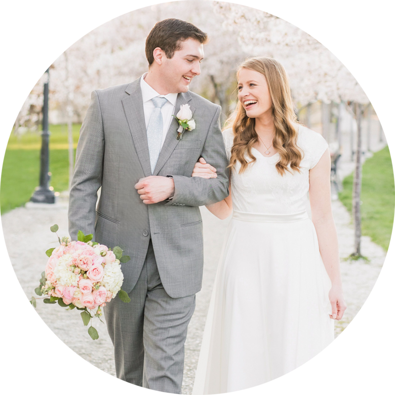 Bride and Groom walking in the blossoms at the Utah State Capitol