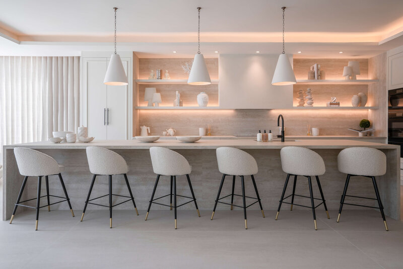 sleek white kitchen decorated in neutrals