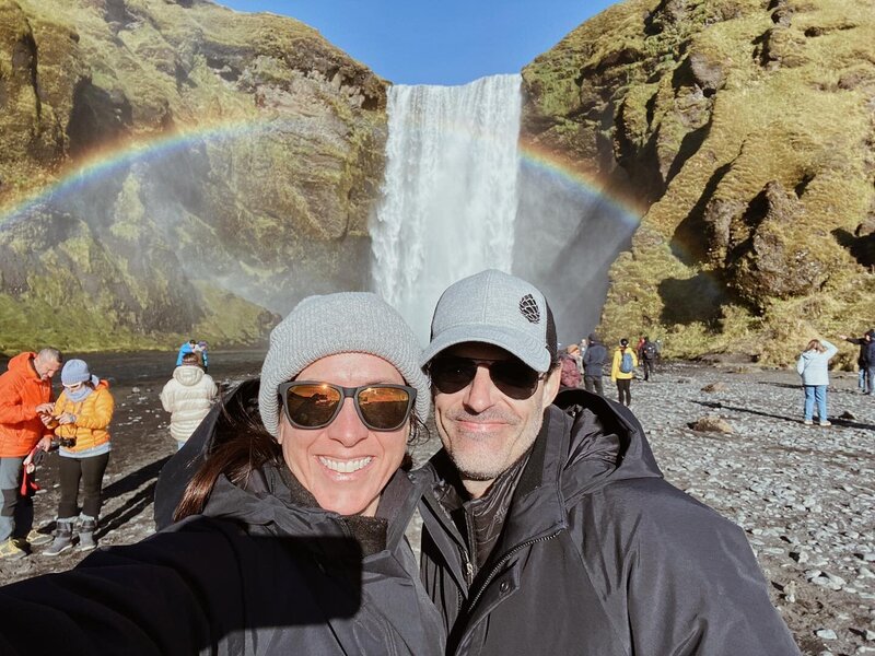 Brad and his wife at a waterfall