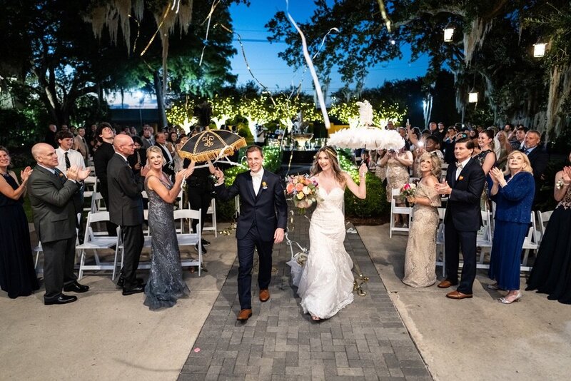 Couple comes down aisle at end of Southern Oaks wedding in New Orleans