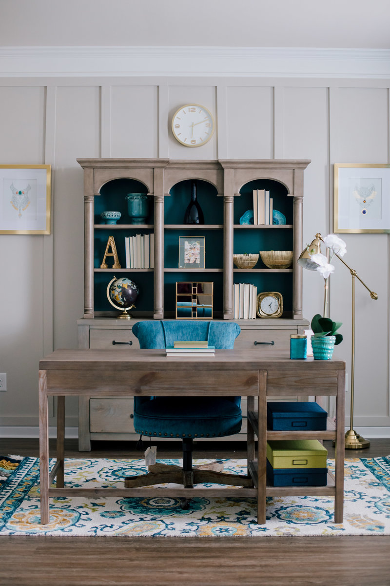 home office with a blue, green, and brown color scheme