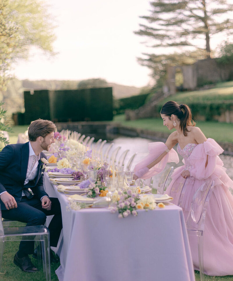A Bride & Groom at an outdoor wedding table in the UK countryside