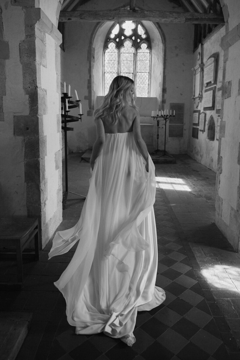 Bride wearing customizable silk wedding seperate, mounted on silk corset, in church