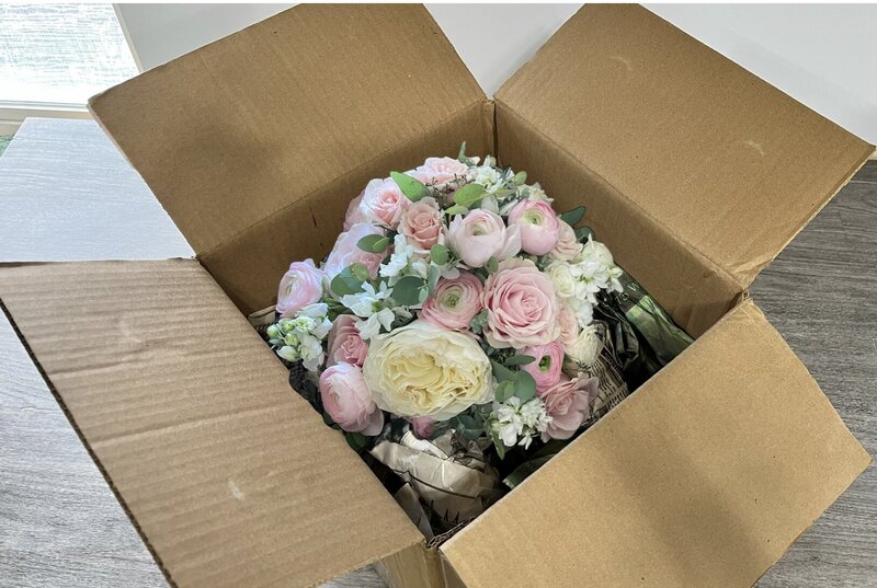 fresh wedding bouquet ready to be shipped