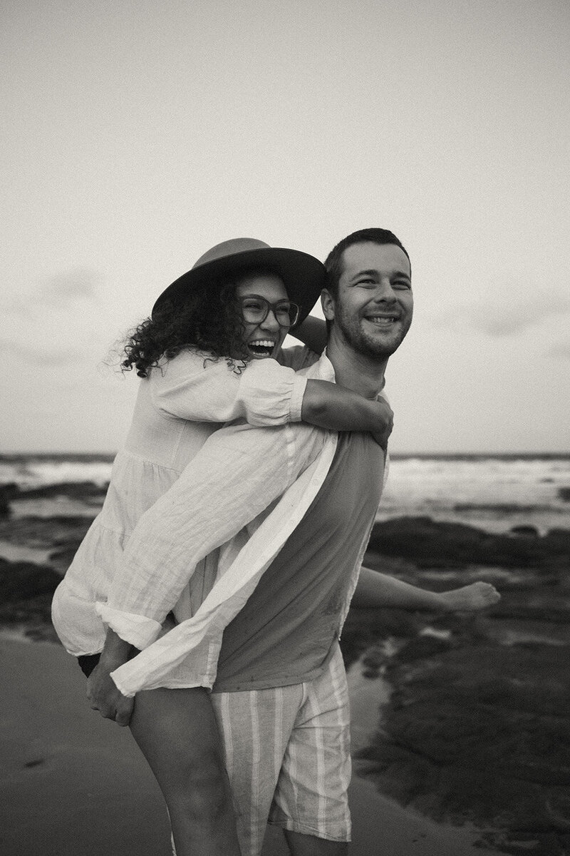 A child cuddling up his mother on a bike a Sunshine Coast family photoshoot
