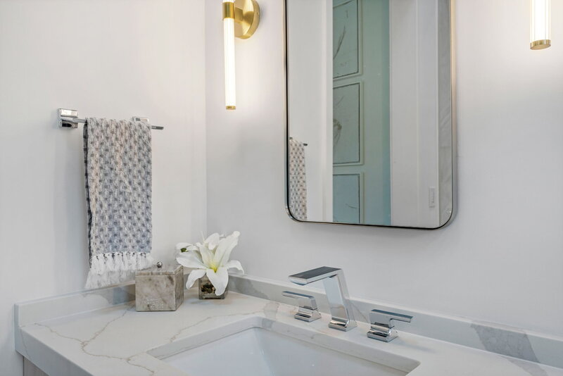 gold sconces with bathroom vanity