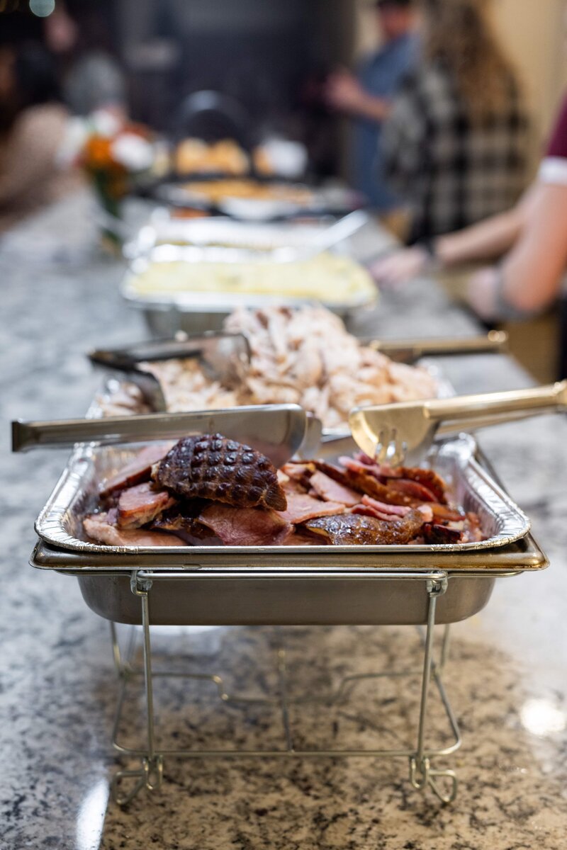 trays full of ham and chicken