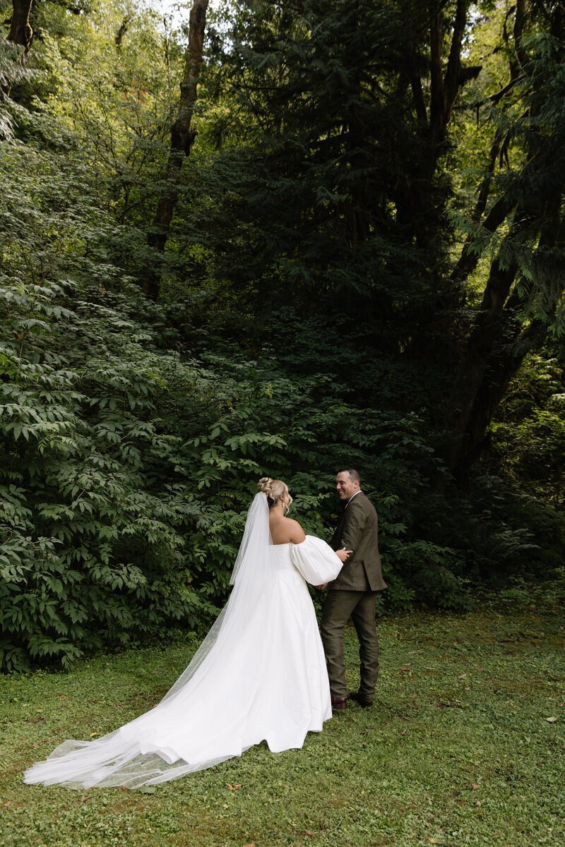 Bride and groom share first look before ceremony in Vancouver, Washington by destination wedding photographer Erica Rochelle Photography