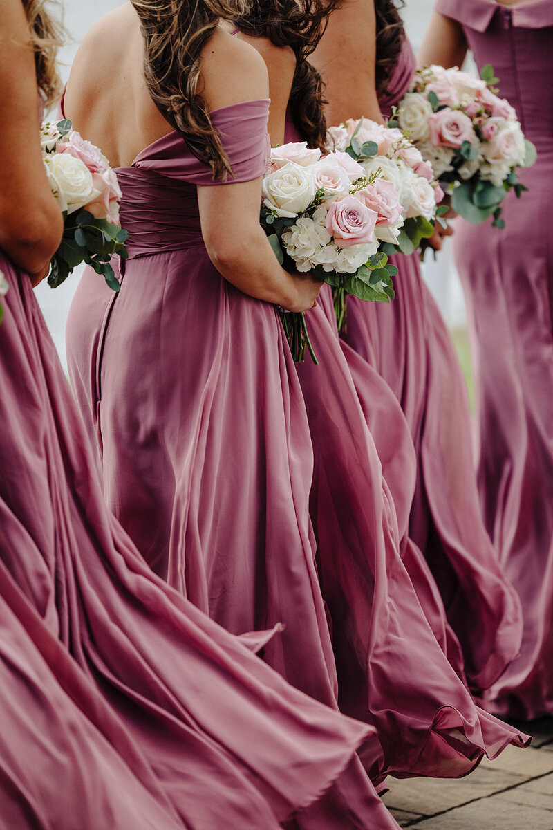 two women wearing lace wedding dresses