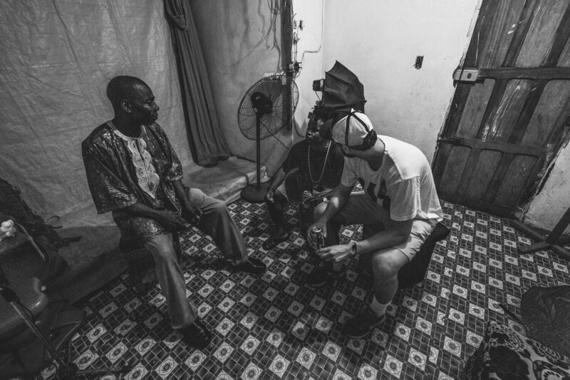 Three Men Sitting And Talking, From The Liberia Collection