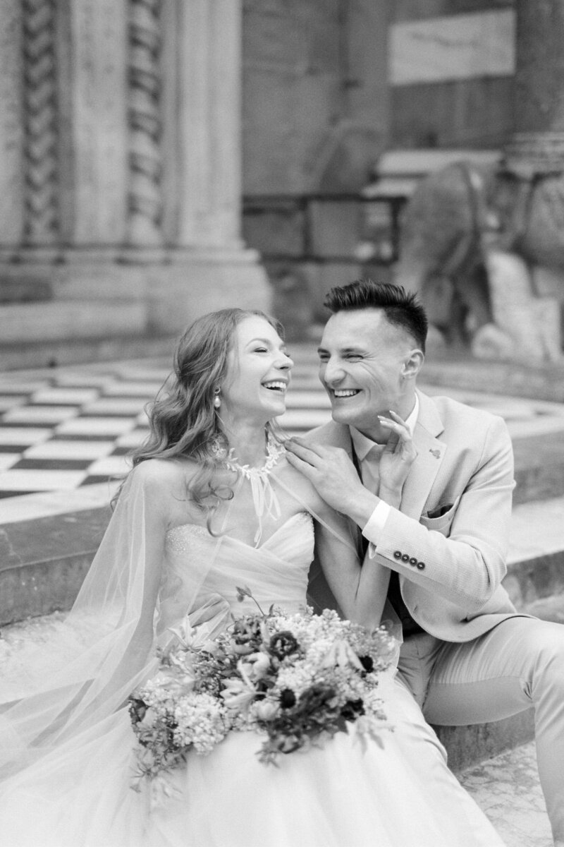 bride-groom-laugh-sitting-steps-church-bergamo-italy