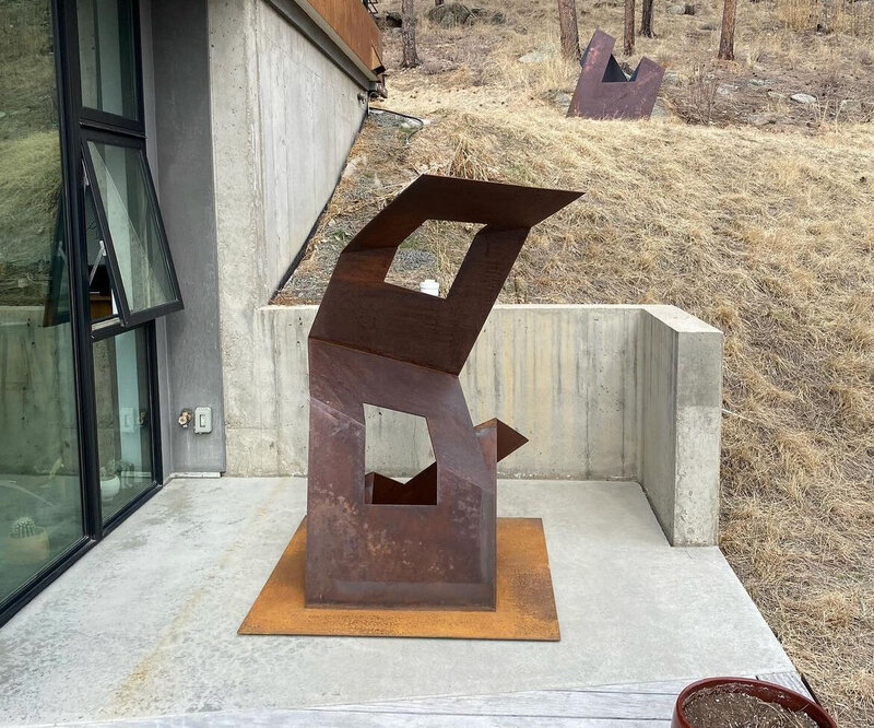 Professional sculpture and art installation by crane service in foothills and mountains