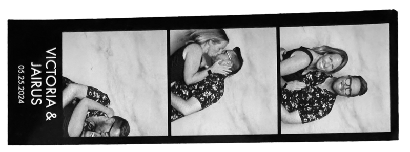 man and woman in a photobooth