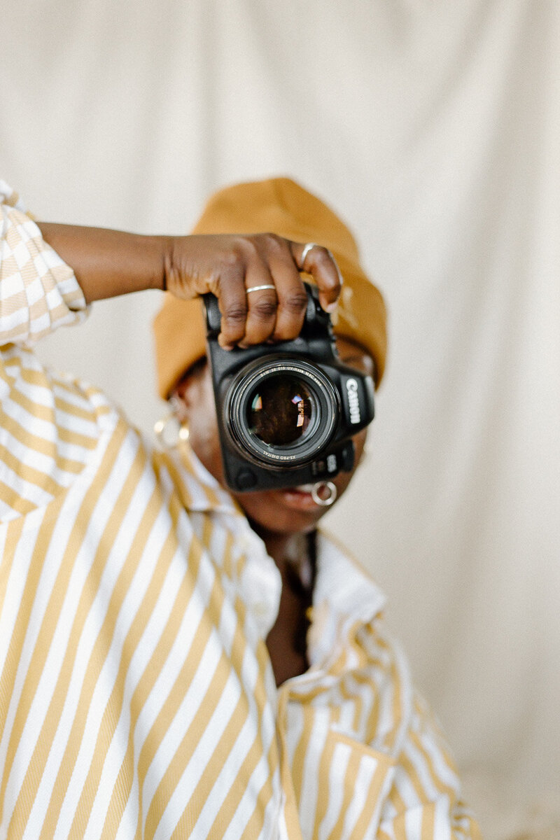 black photographer taking photos