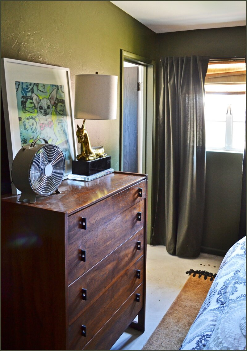 Mid-century modern guest bedroom with green accents