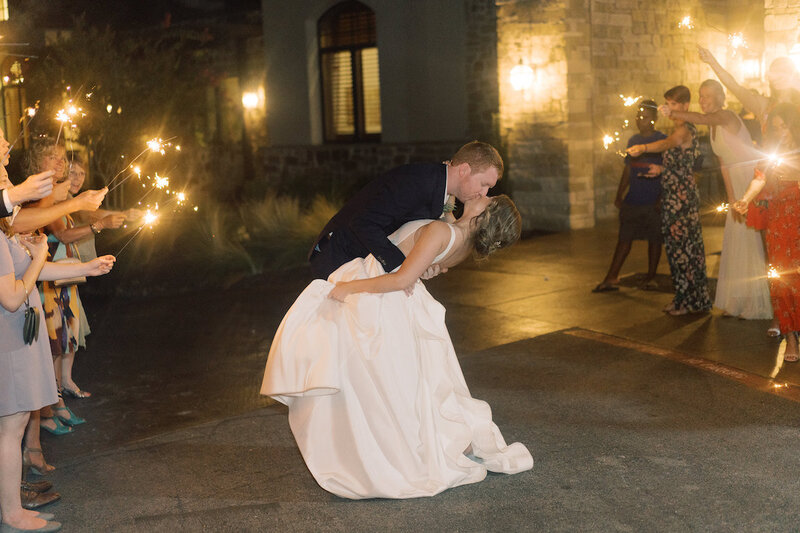 Bride and groom’s grand exit from Canyonwood Ridge reception hall