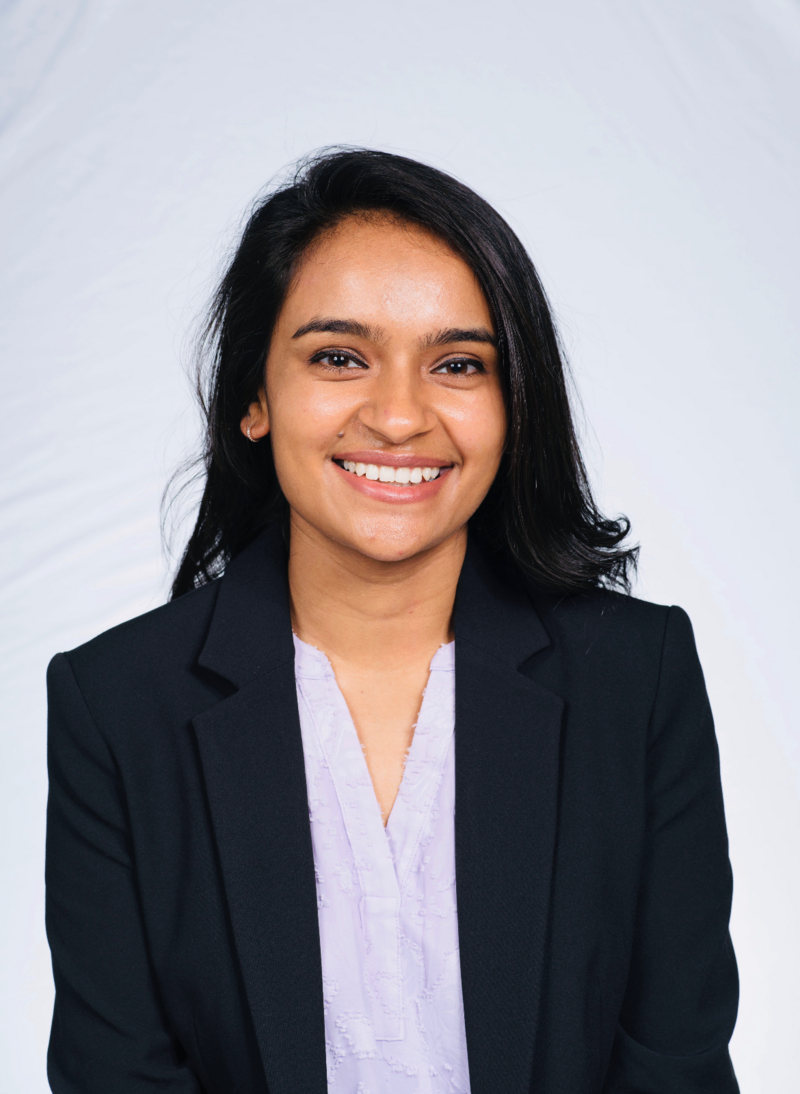 headshot of Dr. Patel in a white shirt and black blazer