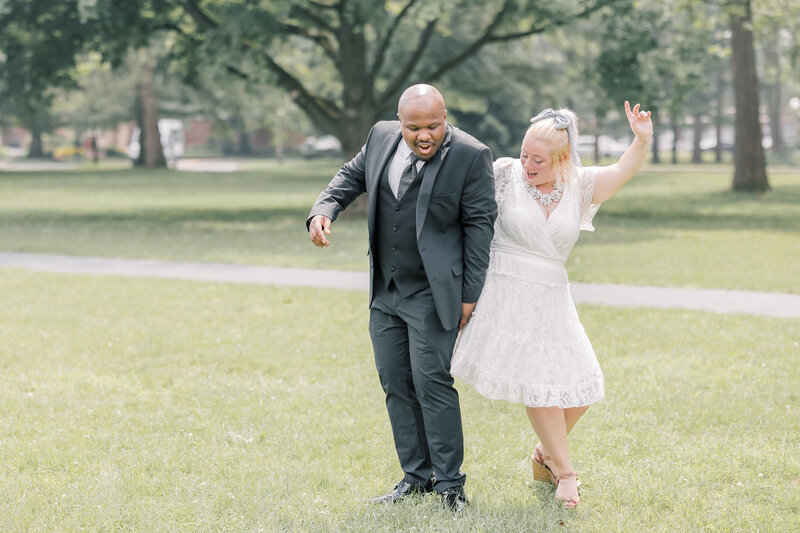 A bride and groom celebrating after their intimate ceremony during their elopement in the Adirondack mountains.