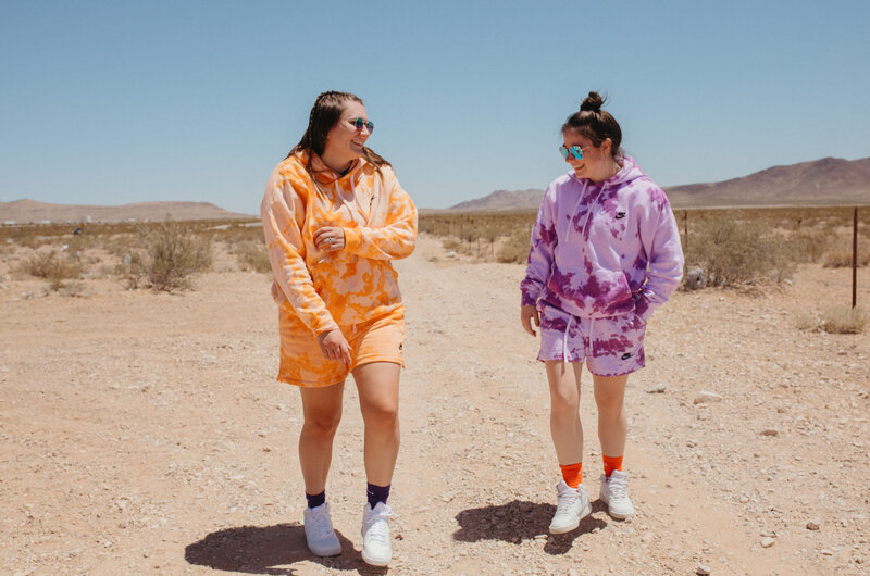 two friends walk in the desert