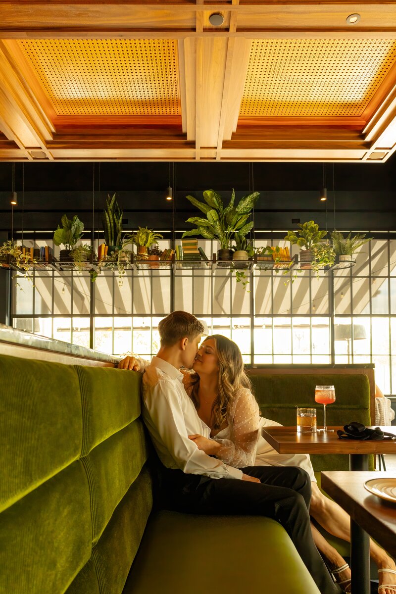 Romantic, intimate engagment session in downtown Omaha using a bar and cocktails at Memoir photographed by Claire Katan Creative.