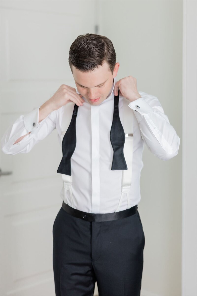 Groom getting ready at the Alfond Inn on his wedding day.