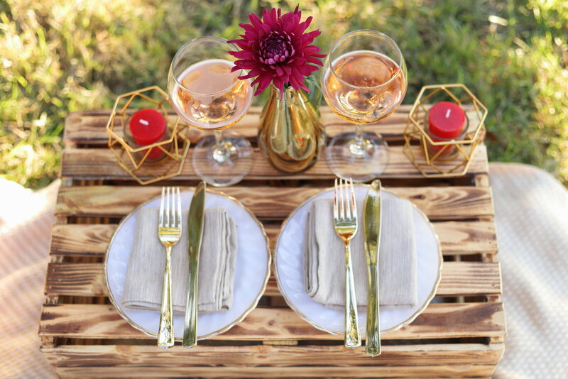 Styled table with glasses, candles, flowers, plates and cutlery for a styled anniversary session
