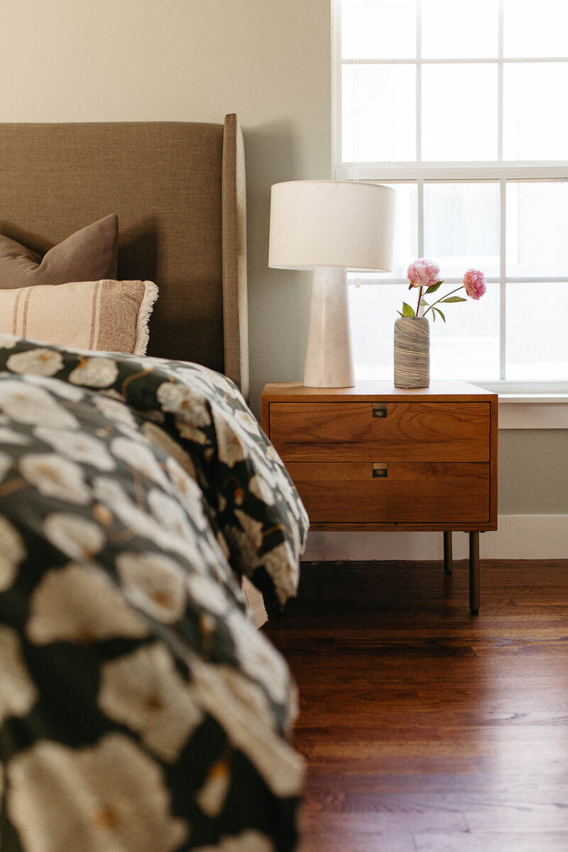 Modern bedroom decorated with patterns and warm tones, designed by Hope Miriam Designs in DFW
