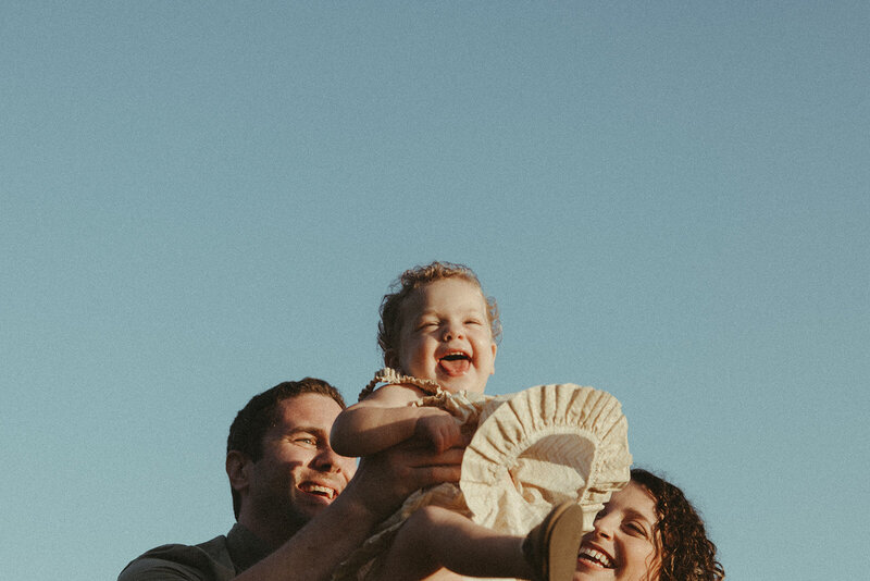 Candid family photography, minimal shot of baby and parents, Intimate Wedding, Elopement, and Family Photography NYC, International, and Western North Carolina Area 