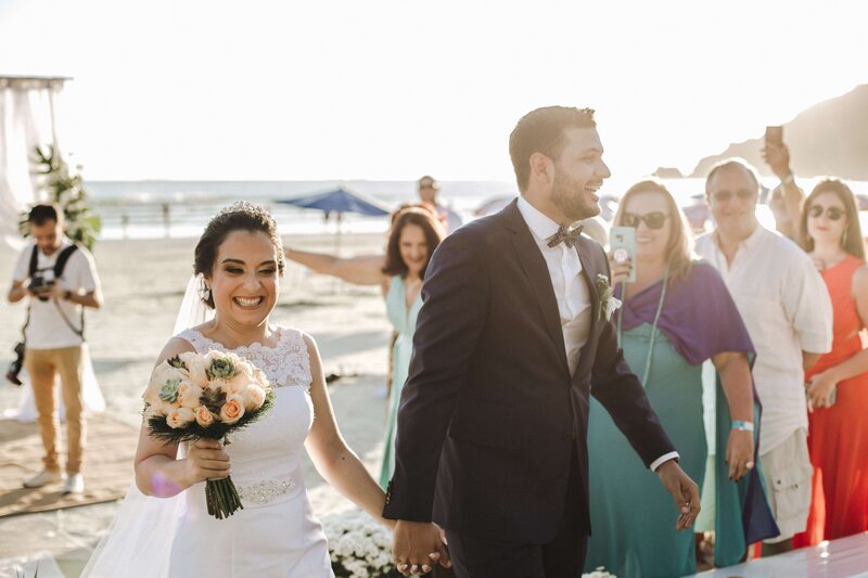 Happy wedding couple at a destination beach wedding
