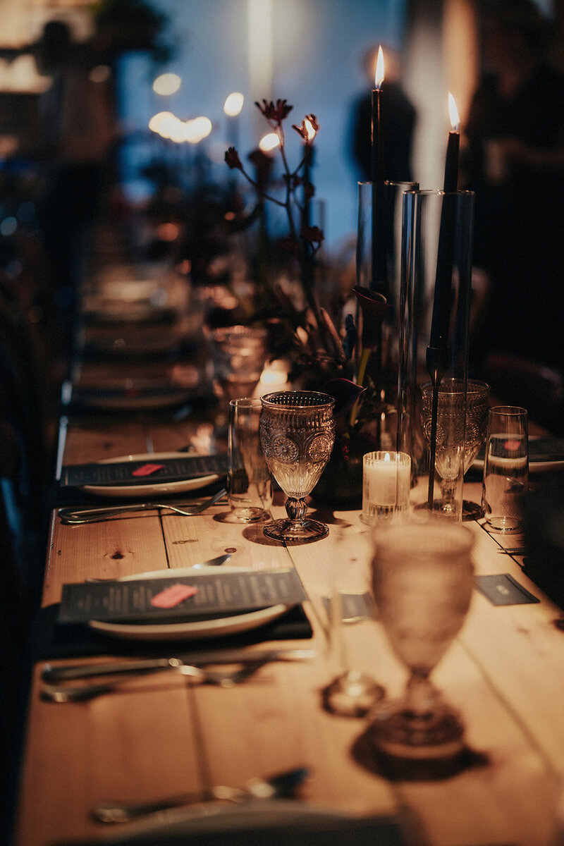 Friends and family enjoying dinner during wedding reception at Mott Street restaurant in Chicago, photographed by Bradi Potter