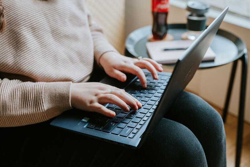 A close-up of hands typing on a laptop, symbolizing the efficient and tailored virtual assistance services offered by KP Virtual Assistance, helping photographers streamline their administrative workflows and optimize their Studio Ninja systems