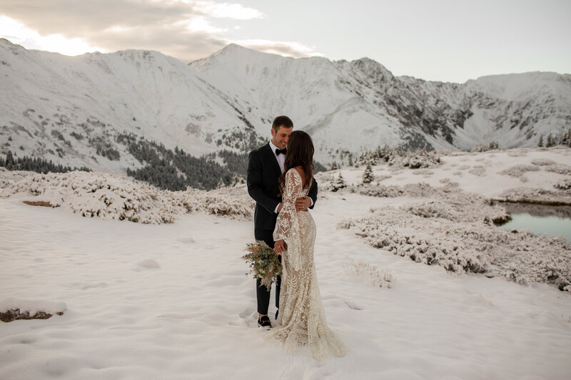 bride and groom in the snow at colorado elopement