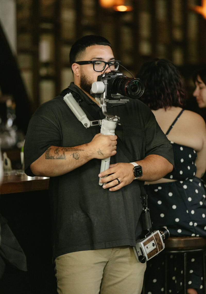 BTS photo of videographer shooting elopement 