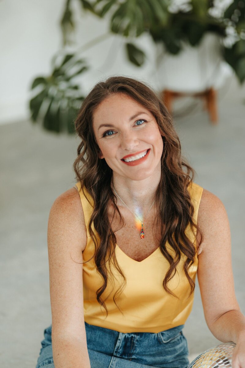 elizabeth smiling in yellow shirt