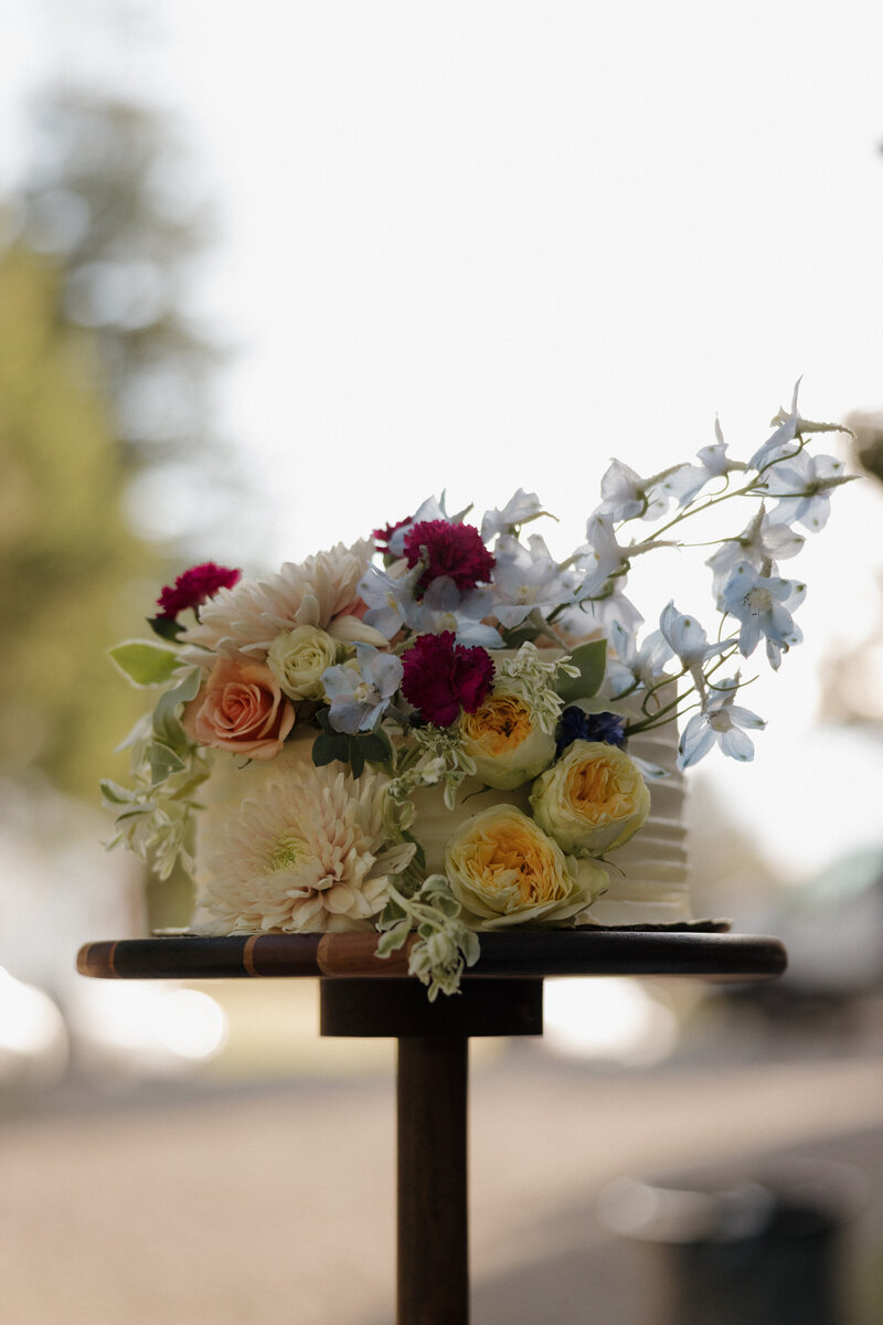 A breathtaking wedding floral installation, where soft, romantic blooms enhance the ambiance of an editorial-style destination wedding.