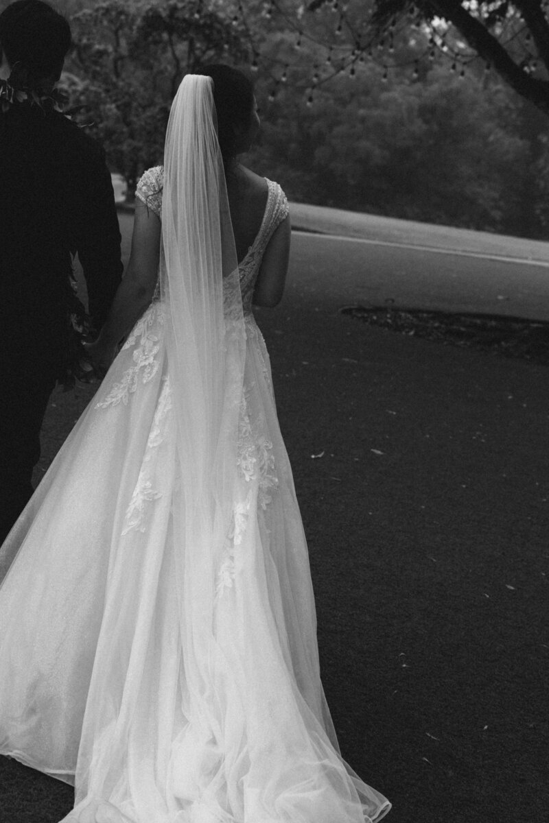 Couple exchanging lei during heartfelt elopement ceremony