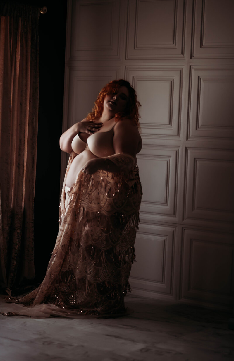 Photo of Minneapolis boudoir photographer Andrea baue in a sparkly robe